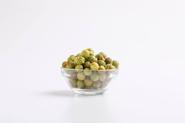 Indian snack dry spicy green pea in glass bowl