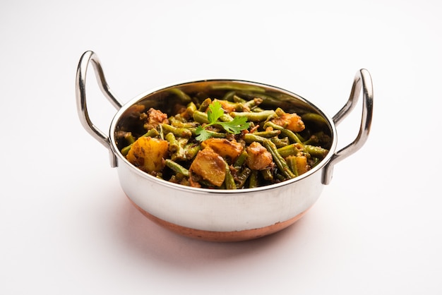 Indian style Chawli Aloo subji or sabzi, long bean and potato dry fry, served in a bowl, selective focus