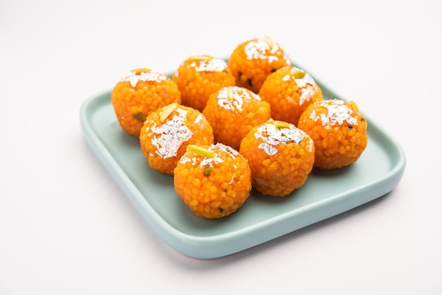 Indian sweet motichoor laddooÃÂ or Bundi laddu made of gram flour very small balls or boondis which are deep fried and soaked in sugar syrup before making balls