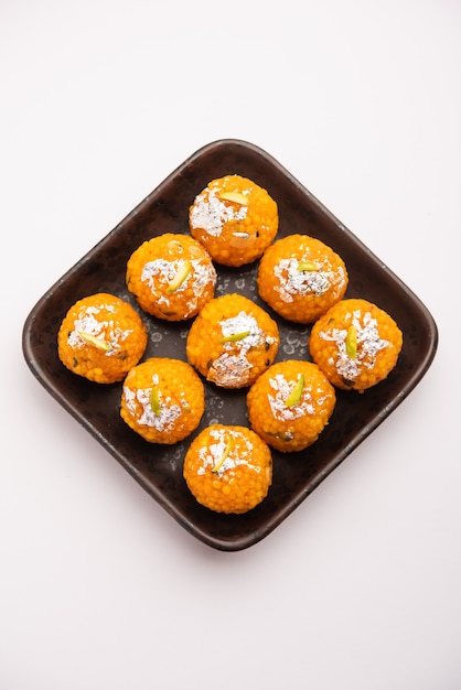 Indian sweet motichoor laddooÃÂ or Bundi laddu made of gram flour very small balls or boondis which are deep fried and soaked in sugar syrup before making balls