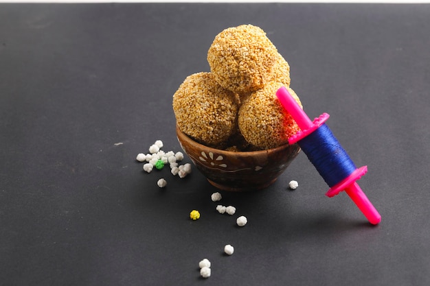 Indian sweet for traditional festival makar sankranti :Rajgira laddu made from Amaranth seed in Bowl on white background.