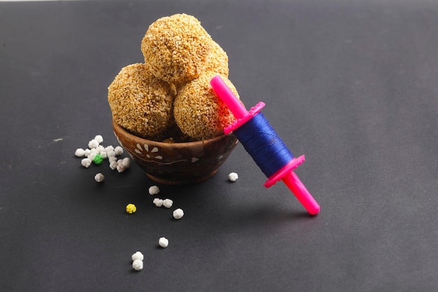 Indian sweet for traditional festival makar sankranti :Rajgira laddu made from Amaranth seed in Bowl on white background.