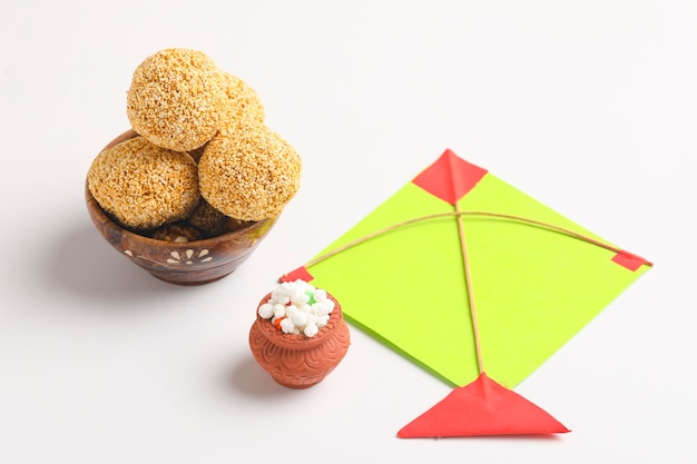 Indian sweet for traditional festival makar sankranti :Rajgira laddu made from Amaranth seed in Bowl on white background.