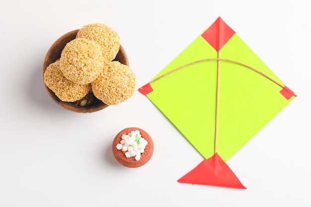 Indian sweet for traditional festival makar sankranti :Rajgira laddu made from Amaranth seed in Bowl on white background.