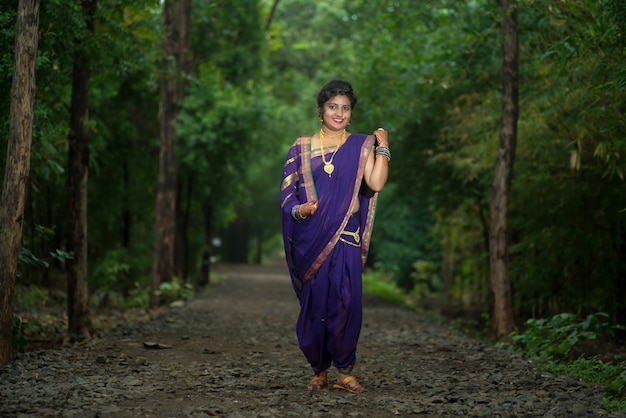 Indian Traditional Beautiful young girl in saree posing outdoors