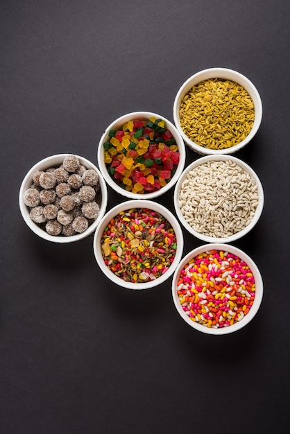 Indian variety of traditional mouth freshener in white ceramic bowls, selective focus