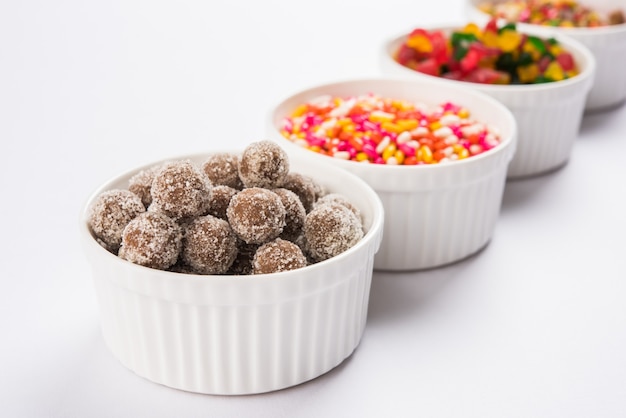 Indian variety of traditional mouth freshener in white ceramic bowls, selective focus