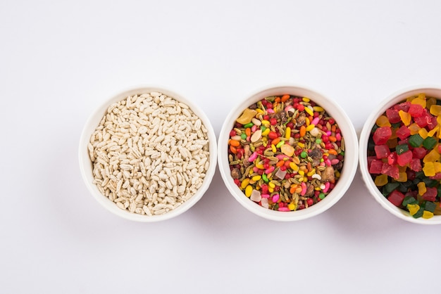 Indian variety of traditional mouth freshener in white ceramic bowls, selective focus