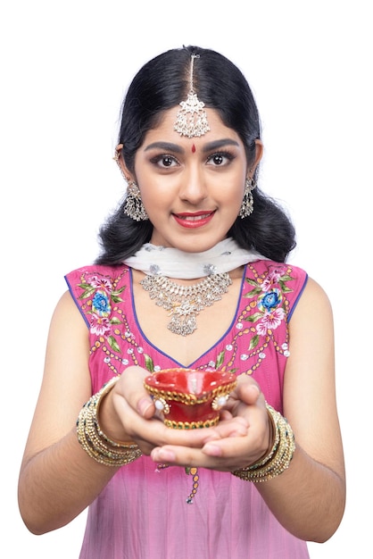 Indian woman holding Diya oil lamps for the Diwali festival