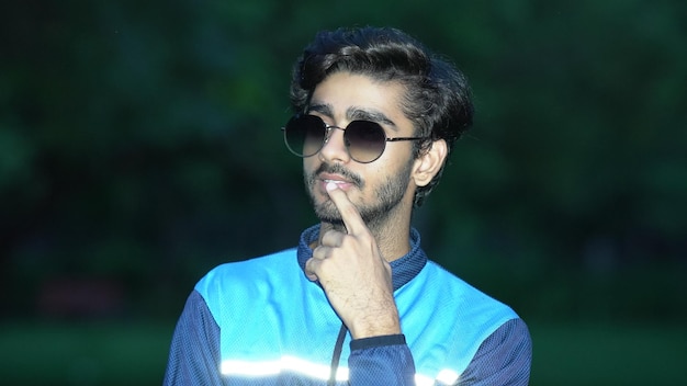 Indian young boy with black glasses