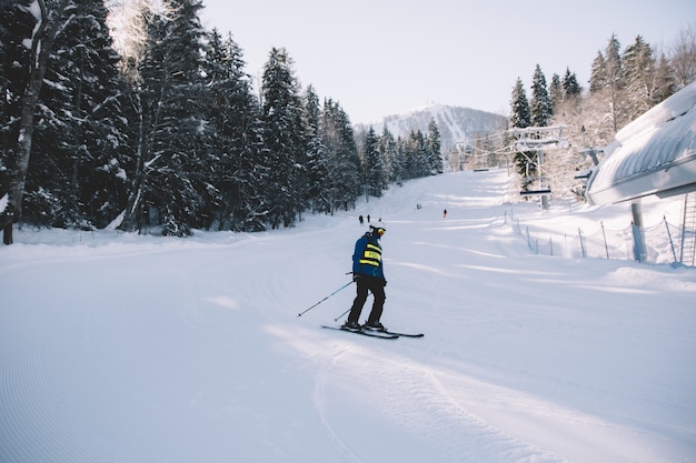 Individual skiing on a snowy track