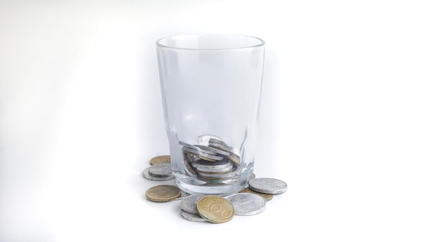 Indonesia Coins in Glass Saving money concept Selective Focus