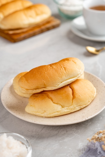 indonesian Bread with grated coconut filling plating on plate