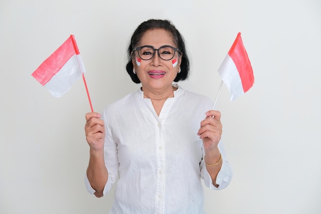 Indonesian elderly woman celebrate independence day with excited expression