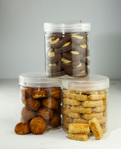 Indonesian famous cake for celebrate Ied Mubarak, famous cookies in a jar with a pink clear backgrou