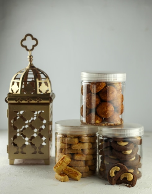 Indonesian famous cake for celebrate Ied Mubarak, famous cookies in a jar with a pink clear backgrou