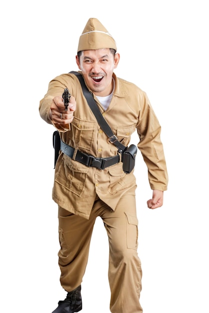 Indonesian freedom fighter standing while holding gun