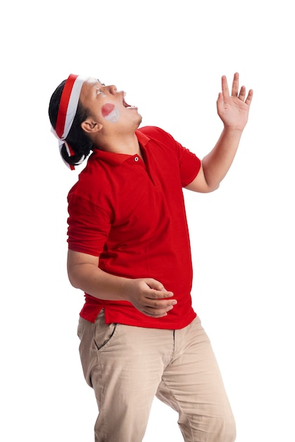 Indonesian men celebrate Indonesian independence day on 17 August with crackers eating competition