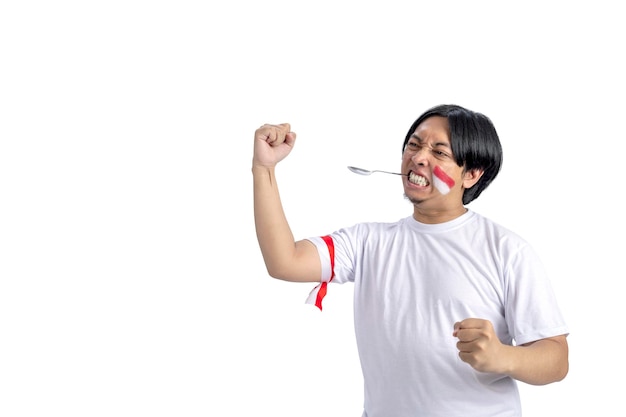 Indonesian men celebrate Indonesian independence day on 17 August with a marbles race using a spoon isolated over white background