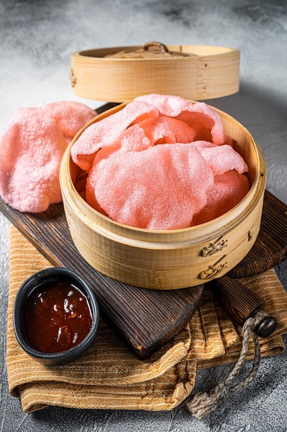 Indonesian prawn shrimp crackers or chips with sauce White background Top view