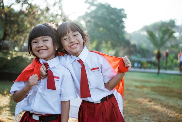 Indonesian school students holding flag during independence day