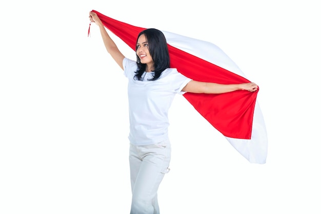 Indonesian women celebrate Indonesian independence day on 17 August by holding the Indonesian flag