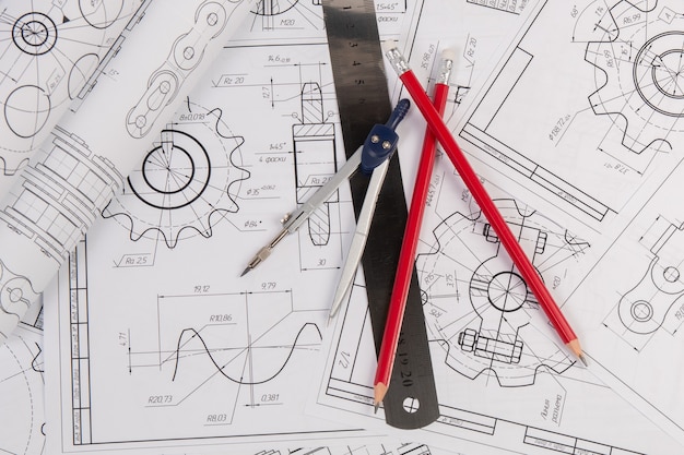 Industrial chain drawings, engineering compass, ruler and pencils