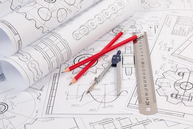 Industrial chain drawings, engineering compass, ruler and pencils