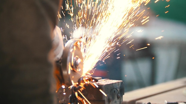 Industrial concept Construction site The man worker grinding Fire sparkles