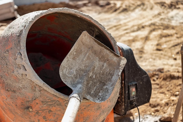 Industrial concrete mixer at a construction site Mixing concrete and mortar on site Construction equipment