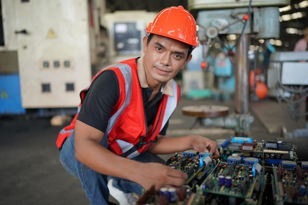 Industrial Engineers in Hard Hats.Work at the Heavy Industry Manufacturing Factory.industrial worker indoors in factory. man working in an industrial factory.