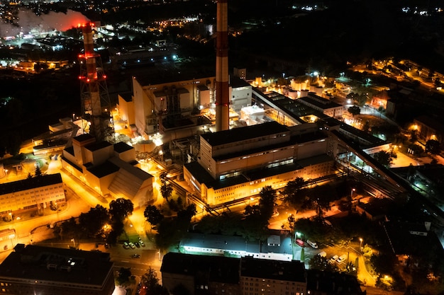 Industrial power plant night landscape with lights aerial view