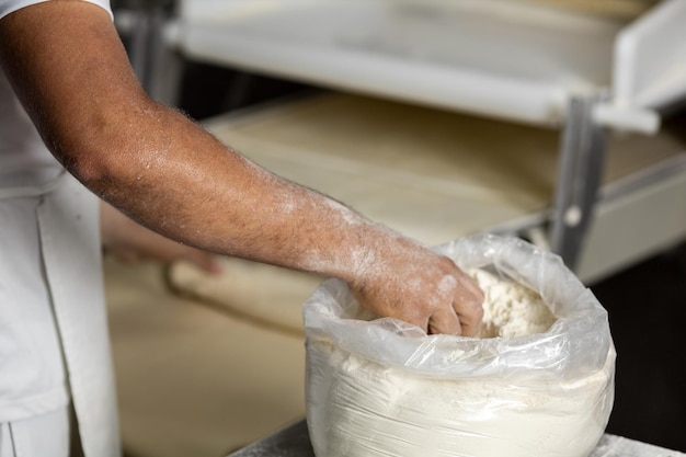 Industrial production of bakery products, preparing dough