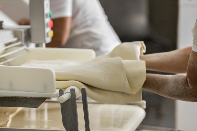 Industrial production of bakery products, preparing dough