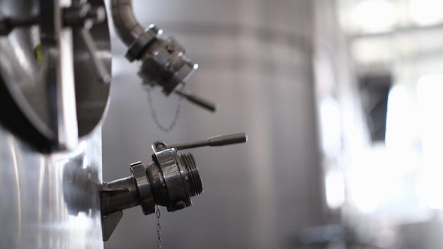 Industrial stainless steel silo and crane used in modern winemaking