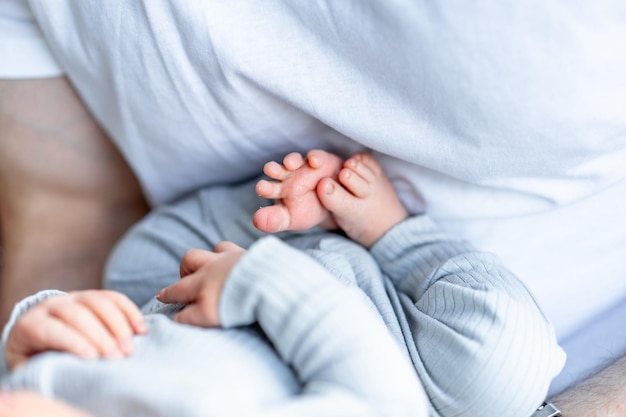 Infant baby holding close up Little newborn in hands