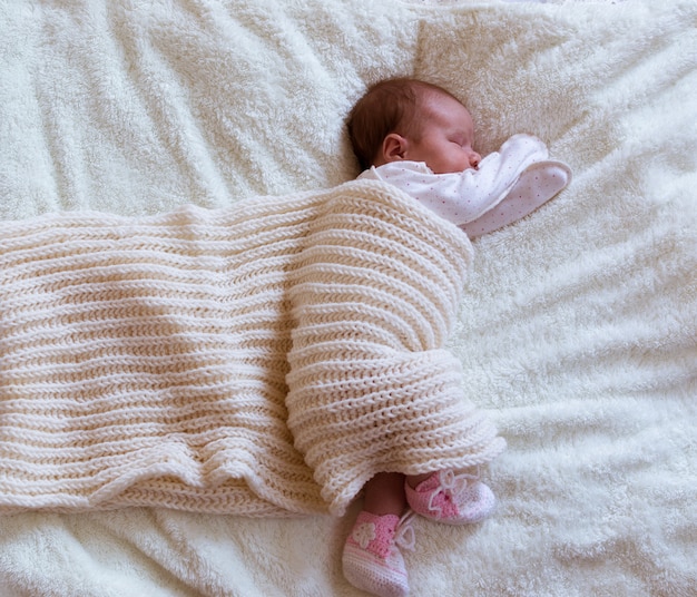 Infant baby portrait in white