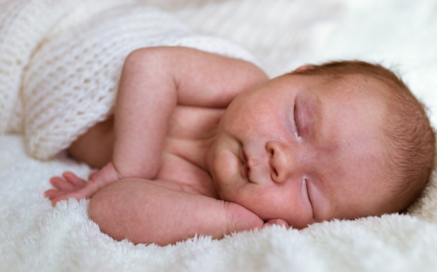 Infant baby portrait in white