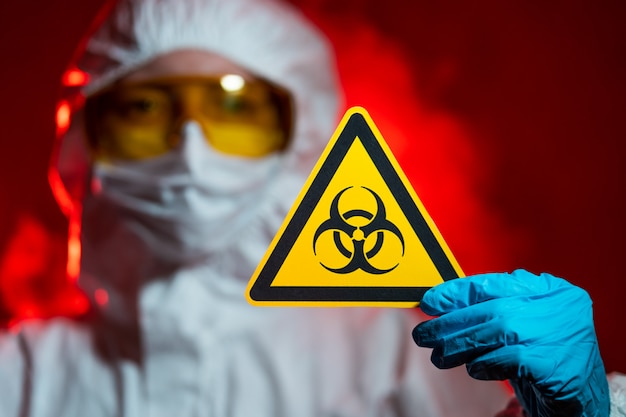 Infectionist holds a biohazard sign. Closed Zone, Quarantine