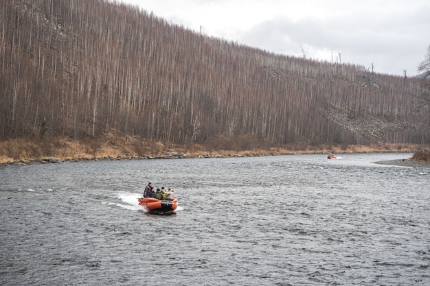 Inflatable motor boat. fishing boat on a mountain river. Anyui River.