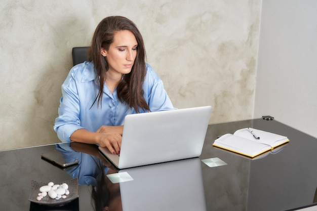 Influencer at home desk with laptop