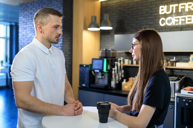 Informal communication between two colleagues during a coffee break