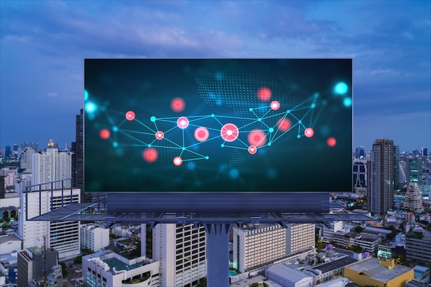 Information flow hologram on road billboard night panorama city view of Bangkok The largest technological center in Southeast Asia The concept of programming science