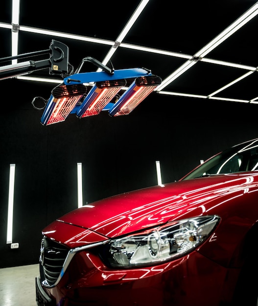 Infrared lamps drying a car