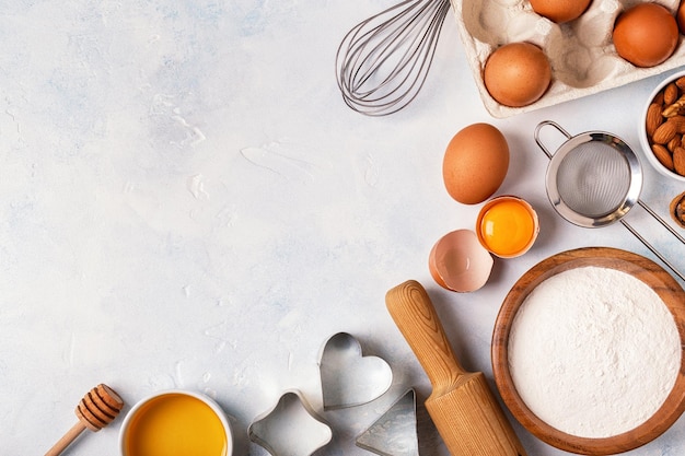 Ingredients for baking flour wooden spoon eggs