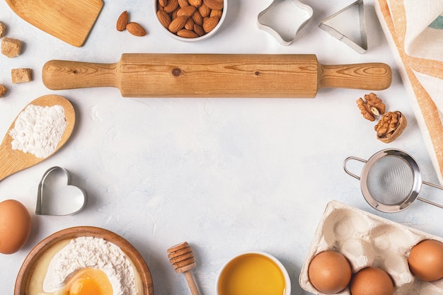 Ingredients for baking flour wooden spoon eggs