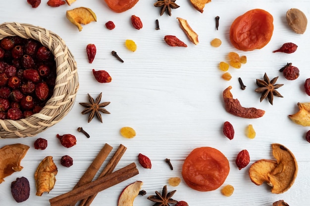 Ingredients for compote rosehip apples raisins dried apricots on a white background