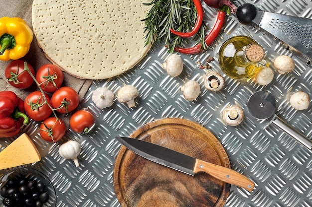 Ingredients for cooking pizza on metal table top view