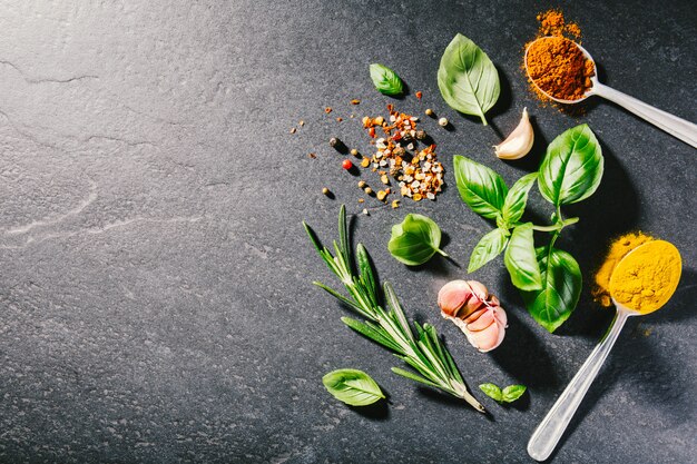 Ingredients for cooking placed on dark background.