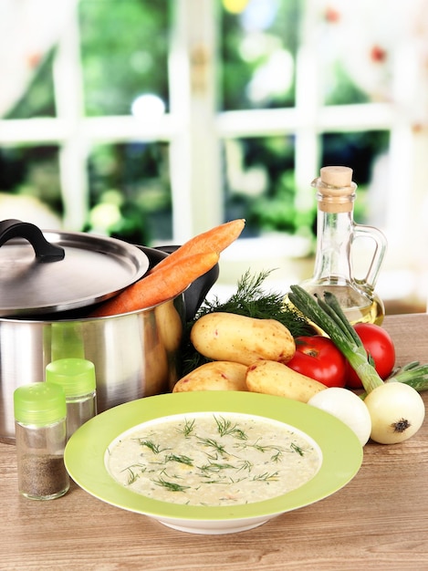 Ingredients for cooking soup on table in kitchen